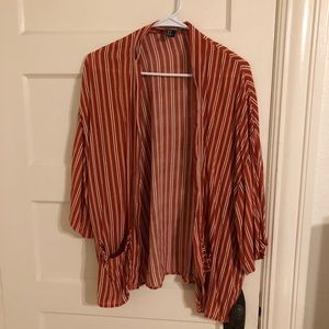Burnt orange, light cardigan. Lightly worn, size medium.